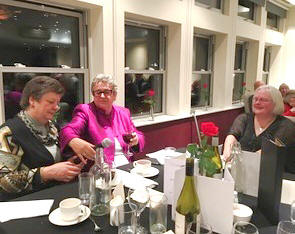 Lin MacMillan, chair, with guests